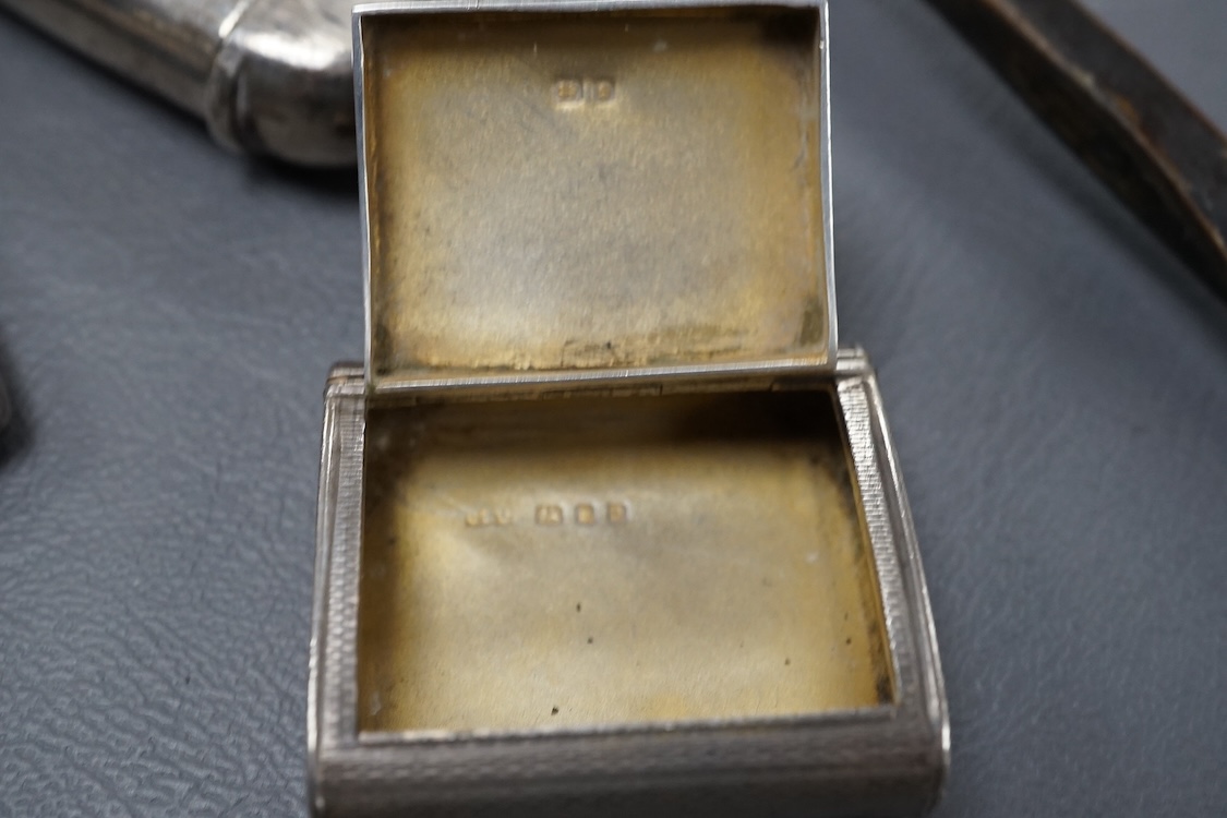 A small group of collectable silver including a George III silver cream jug, London, 1804, height 95mm, three silver vesta cases, two pill boxes, an envelope stamp case, two Georgian toddy ladles, one unmarked, together